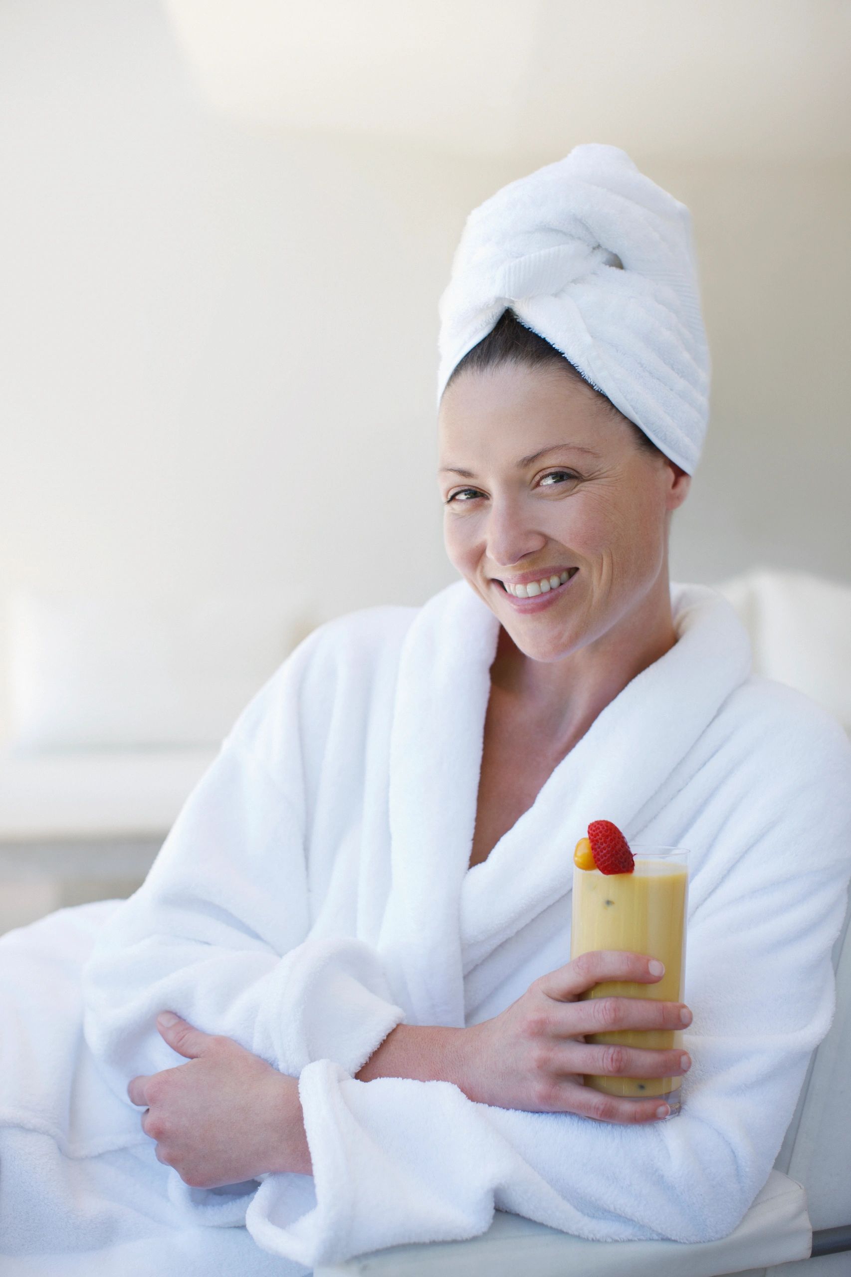 Spa guest in bathrobe enjoying a wellness moment