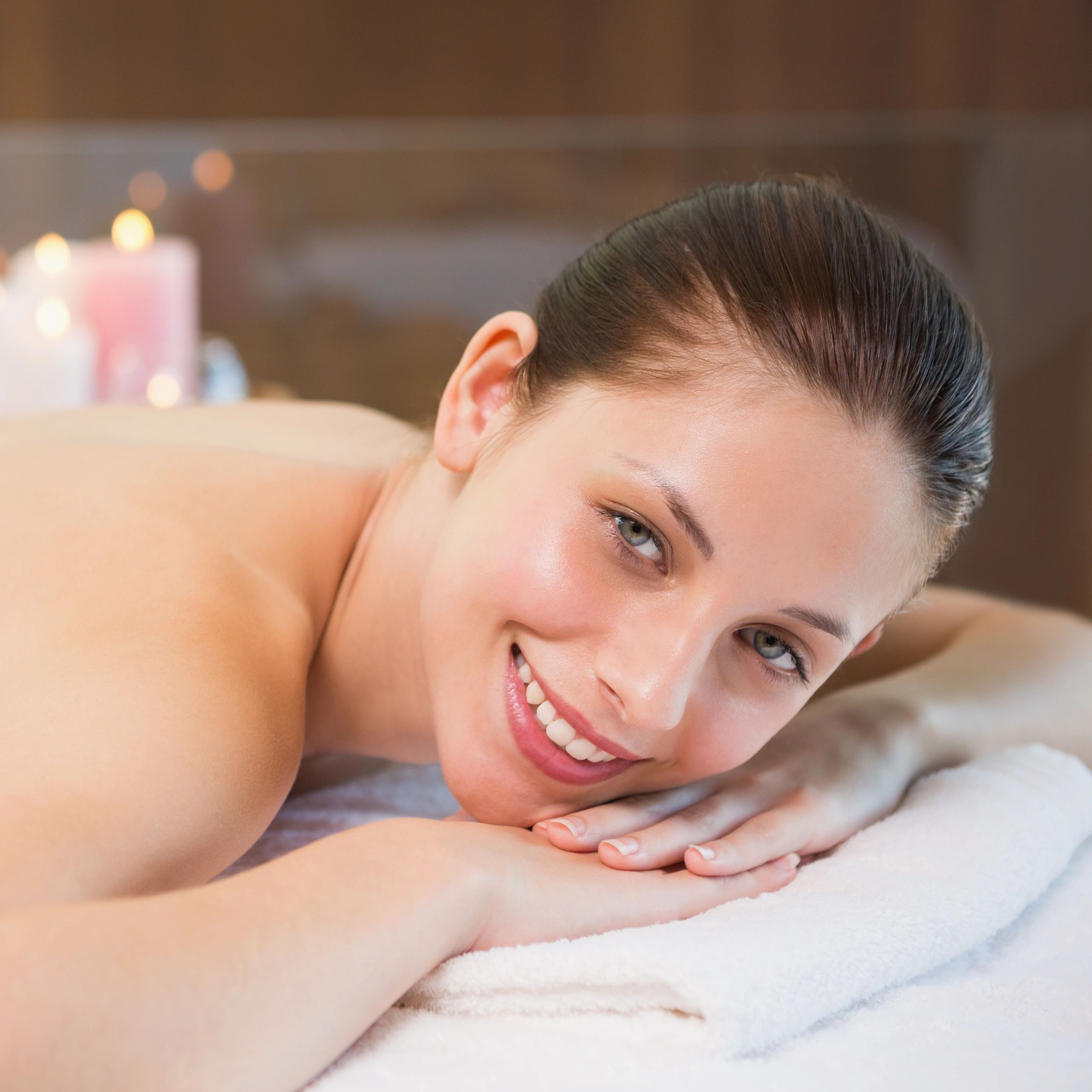 Woman relaxing on a massage table during a spa treatment